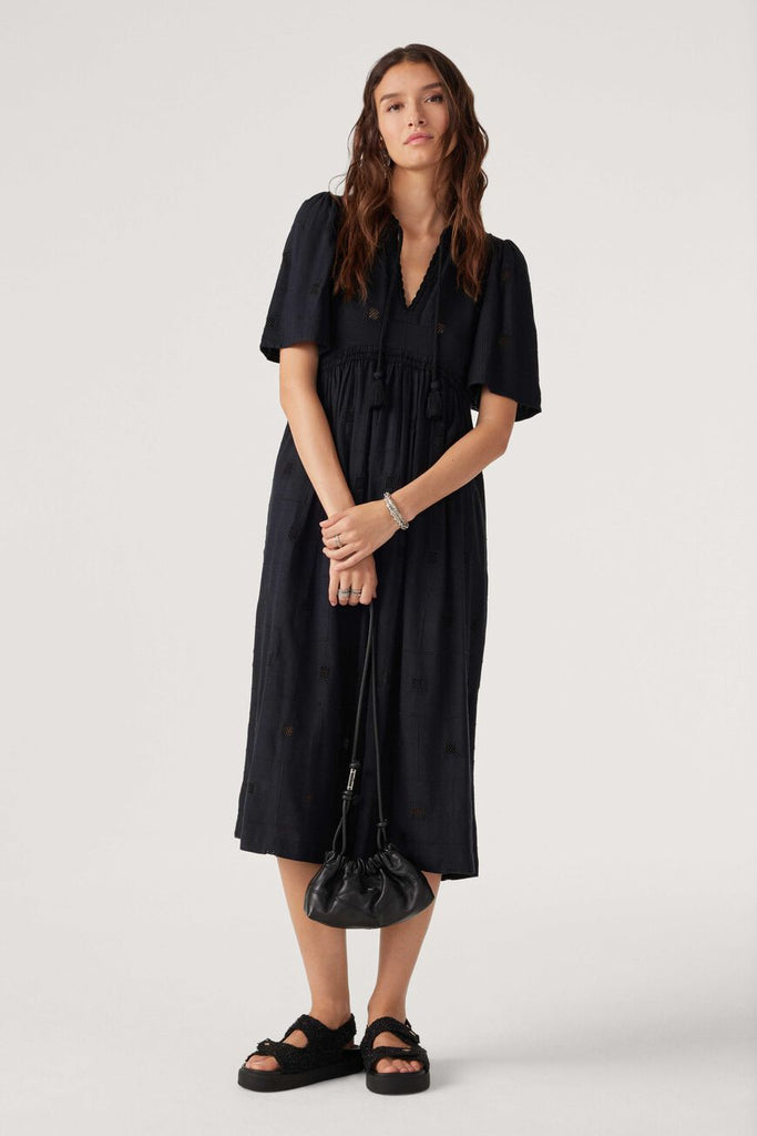 The Romy Dress from Ba&sh features embroidered openwork, an embellished v-neck with pompoms and smocking under the bust. This boho inspired dress is in a light-weight fabric and can be worn with sandals or boots depending on the season.