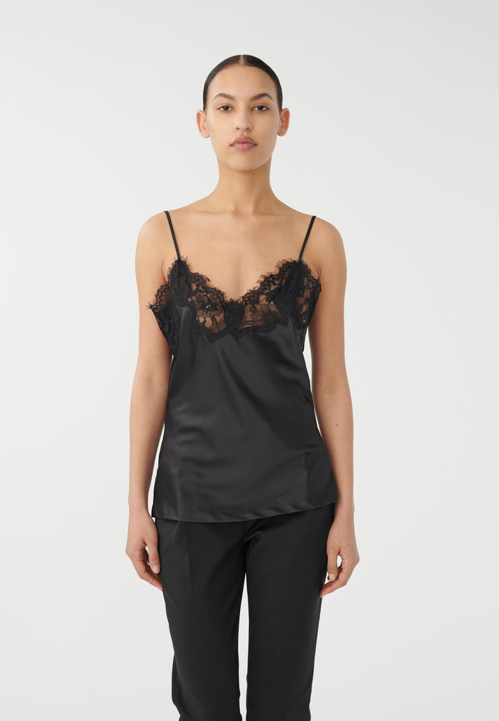 The Verina Camisole from Dea Kudibal features adjustable spaghetti straps and lace detailing across the bust. This pretty cami, in an always classic black, can be worn as is with jeans and a blazer or under a low cut top to add a pretty lace trim.