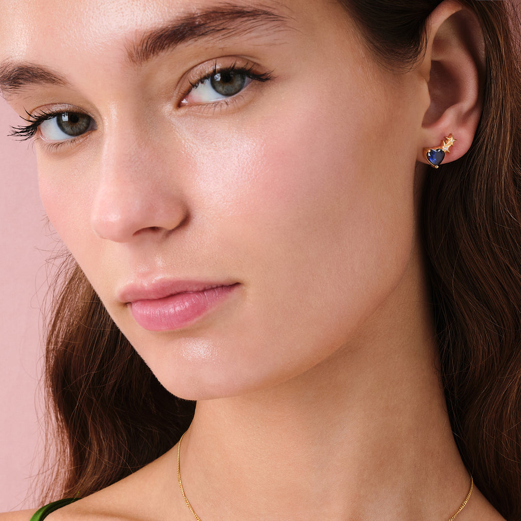 We are excited to be stocking Greek Jewellery brand Marianna Lemos!   The beautiful Heart and Stars Stud Earrings are crafted from 22 carat gold plated Sterling silver and feature a blue crystal heart with two little stars set with white crystals.   Pair with the matching necklace or bracelet (or both!).