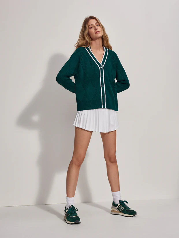 A modern twist on a classic cardigan in retro forest green. Made from 100% cotton with a diamond knit pattern and showcasing a contrasting white tipping detail along the placard, this cardigan will look as good over your tennis whites as well as your white jeans. 