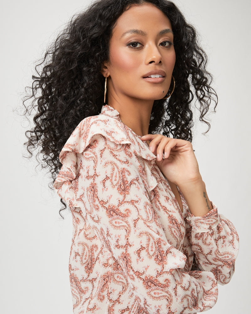 We love a Paige blouse and this one is just as lovely as we've come to expect!  Crafted from 100% silk georgette in a pretty light cream and pink paisley print this ultra feminine top features a flattering v neck line, ruffle details at the shoulder and a crinkle texture.  Great for dressing up or down - tucked in to trousers for the evening or untucked with your favourite Paige denim.