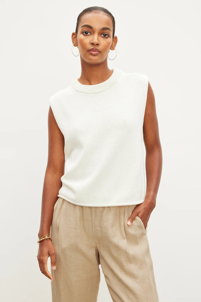 The Aster Top from Velvet by Graham &amp; Spencer is crafted from a luxurious cotton cashmere blend and has a mid-weight feel. This sleeveless sweater features a classic crew neckline and ribbed detailing. The rolled hemline and pointelle details add subtle charm.