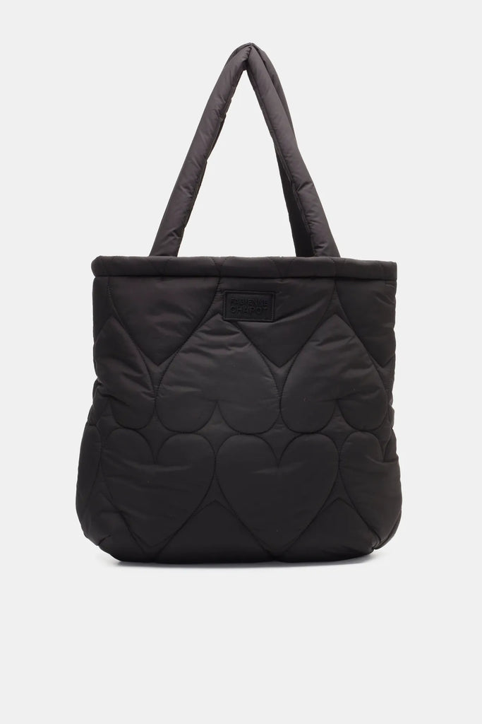 The Prisca Tote Bag from Fabienne Chapot features a quilted heart print, a leather logo patch and an inner zip pocket. Fully lined with handles that sit perfectly on the shoulder, this tote bag is perfect for everyday ease.