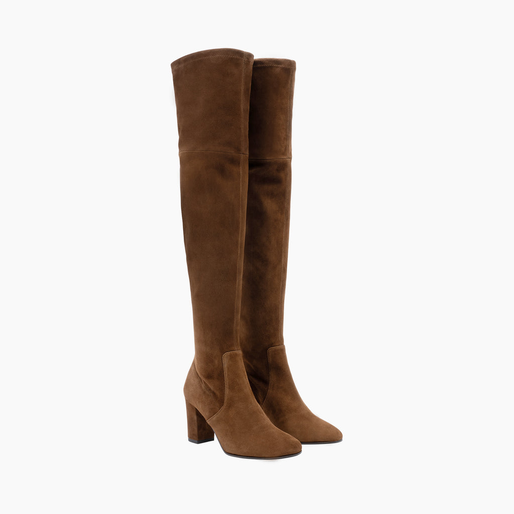 The Zarcas Thigh-High Boots from Parallele are made from a stretch suede in a stunning cognac colour, they also have a leather sole with an anti-slip pad. The wearable block heel measures 7cm with the stem of the boot measuring 60cm. Simply slip on over jeans or under dresses for easy winter styling.