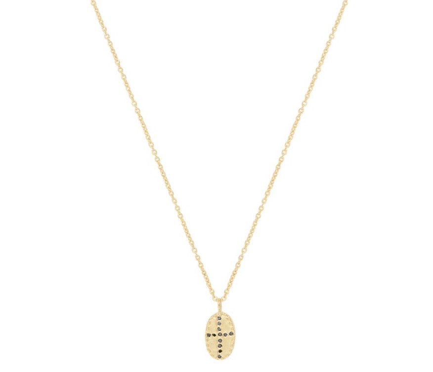 The Bazile Mini Necklace from Louise Hendricks features a brushed and matte oval gold-plated pendant with black zircons set in an irregular cross shape. Length - 48cm.