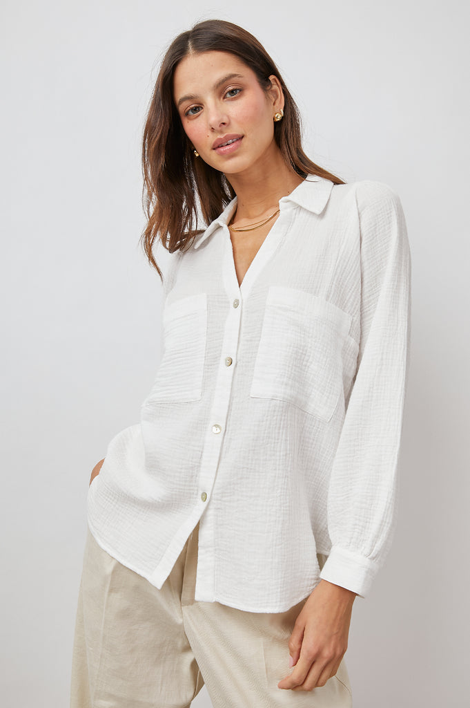 The Lauren Top is a white top that definitely deserves a place in your wardrobe!  Crafted from Rail's signature super soft cotton gauze this is a classic button down  featuring patch pockets, voluminous feminine sleeves and natural shell buttons.  It looks great untucked, with a French tuck or tied at the waist.  You'll reach for this again and again.