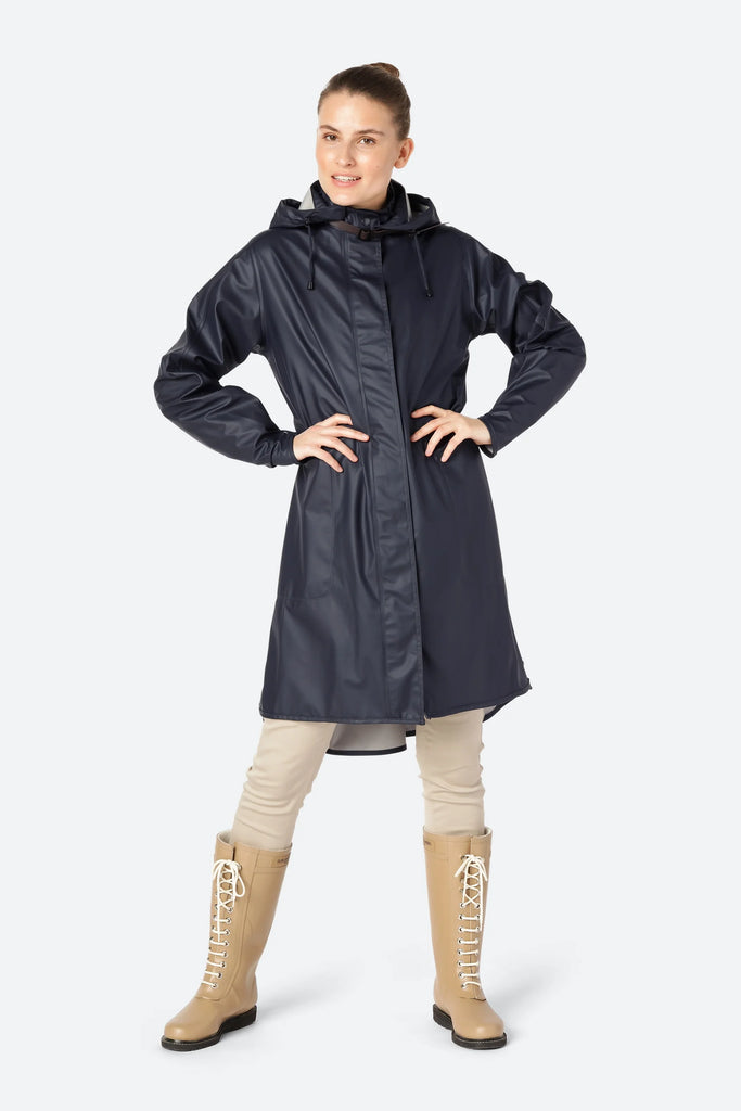 We are delighted to be stocking raincoats from Danish brand Ilse Jacobsen.  The brand is known worldwide for their iconic rainwear inspired by the Nordic environment.          This feminine A-line raincoat is made in a light waterproof fabric and features a detachable hood with artificial leather strap.   It is waterproof enough for the heaviest of showers.  Pair with the Ilse Jacobsen short black wellies to keep you dry on your walks!   