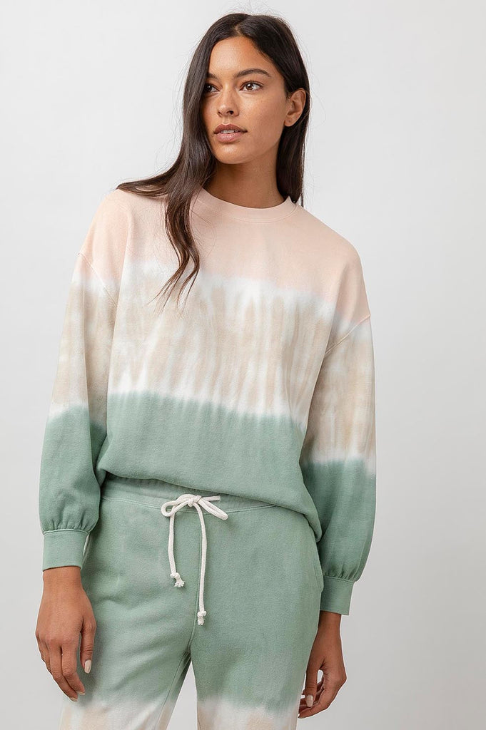 This super soft Reeves Sweatshirt from Rails features a pastel green, sand and peach dip dye design, an oversized fit, dropped shoulders, full sleeves, shirring at the cuffs, and a raw hem. Pair with your favourite denim and trainers for a relaxed every day look.