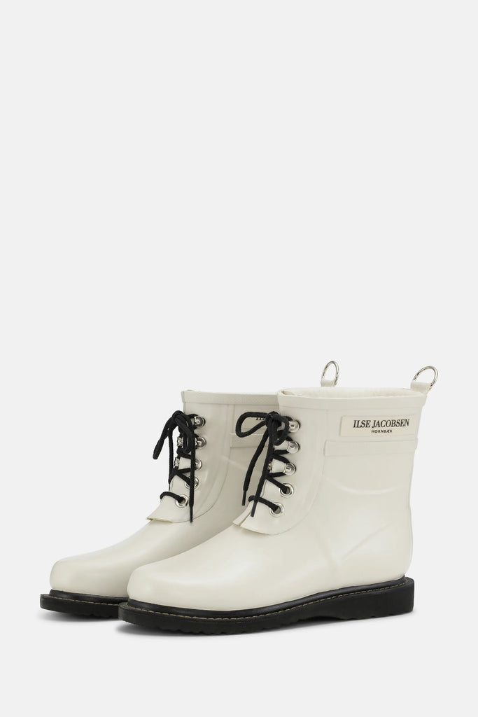 These fun short laced rubber boots in Kit, a milky white, by Ilse Jacobsen have a cosy fleecy lining and black laces.  They look just as at home on a country walk aswell as  navigating those wet city days. They are made of sustainably harvested natural rubber and can withstand temperatures down to -20 degrees Celsius.