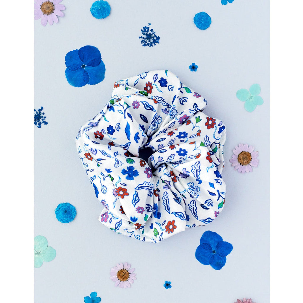 Elevate your scrunchie collection with the super soft silk Jessica Russell Flint scrunchie.   Shown here in the gorgeous Azura print a silk scrunchie not only looks good but it's much better for your hair than your average scrunchie.