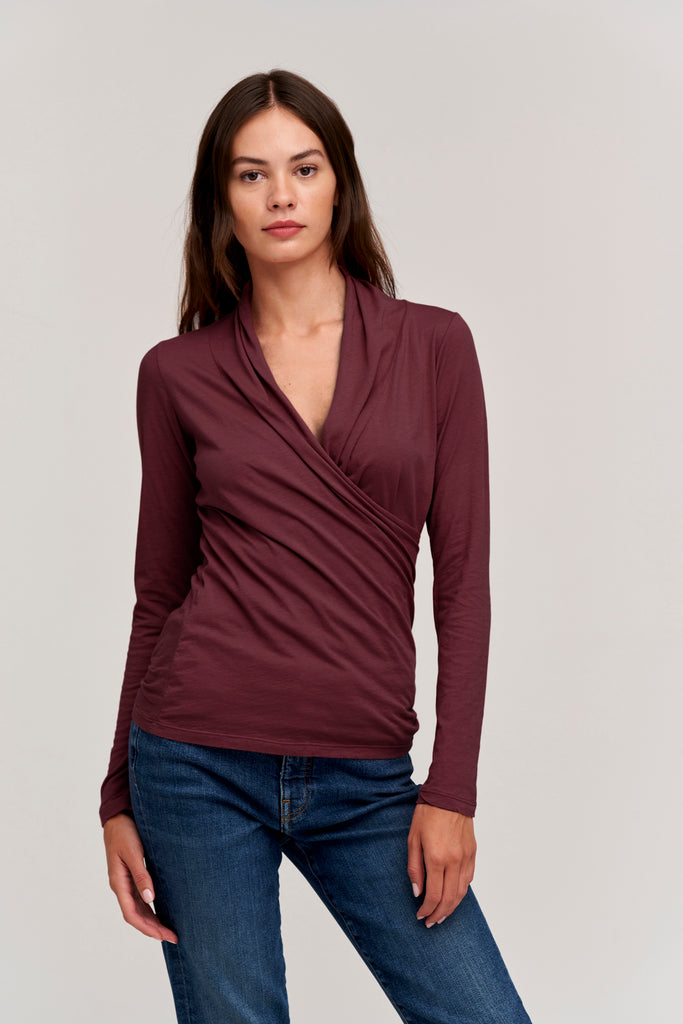 Super soft and just the right amount of sexiness.  In a pretty deep red wine colour this cotton top features long sleeves, a deep v neck and a wrap effect at the waist.  Perfect paired with denim but also looks great with a midi or maxi skirt.