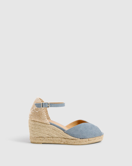 The Bianca Espadrilles from Castaner are incredibly versatile. Made in a pale blue cotton canvas, they are the perfect addition to your summer wardrobe. With an ankle strap with a buckle fastening and a rounded toe - you can wear these espadrilles comfortably from day to night.