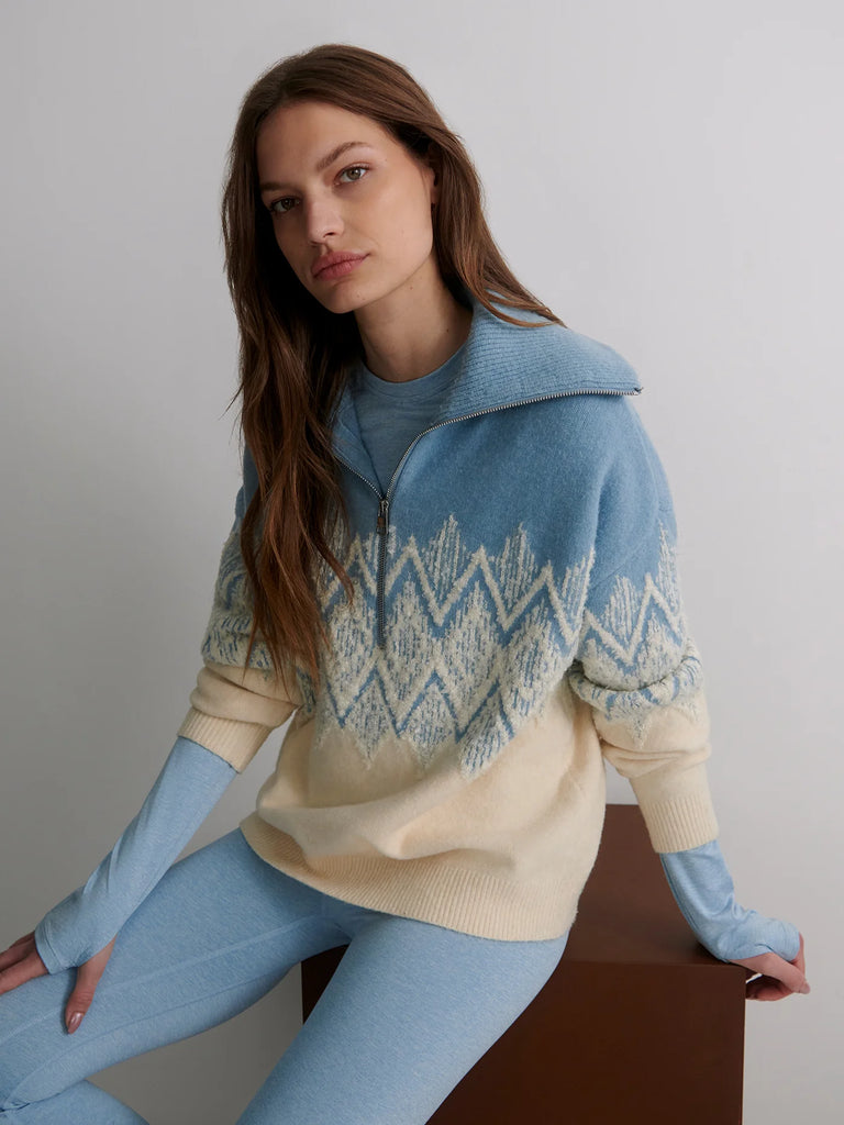 The Hedda half zip from Varley is crafted from a luxurious merino-blend and features a jacquard fairisle pattern in a bouclé yarn for added texture. Super soft and comfortable, it's cut to a relaxed, longline shape and features a half-zip collar.&nbsp; It will be perfect over winter baselayers and leggings or slim trousers.