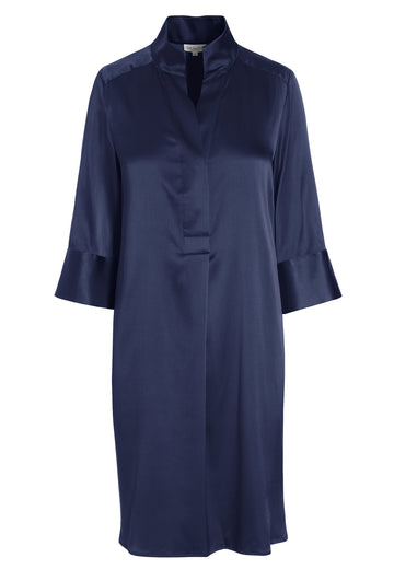 Referencing the chic elegance of a kimono, the Kamille shirt dress from dea kudibal features deep cuffs and a cross over neckline. This silk dress offers a relaxed fit that works beautifully for both day and evening occasions. 