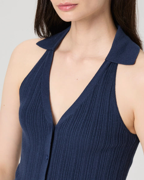 Crafted from a luxurious Eco Peachskin fabrication the Noella Tank in always wearable navy is a fabulous basic for your wardrobe.&nbsp; Featuring a polo collar, a flattering deep v with a pleated effect and buttons down the front this is perfect paired with your favourite wide legged denim.