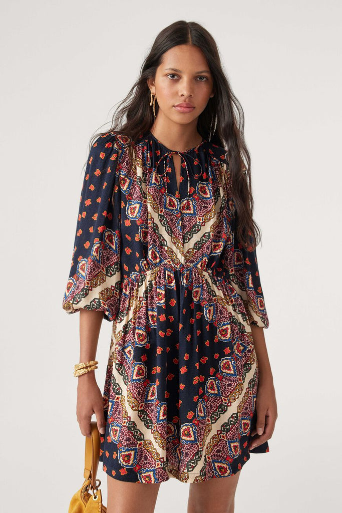 With a nod to boho chic the Jasper Mini Dress features a deep v neck decorated with ties, elasticated waist to highlight your waist, tight wrists and long puff sleeves.  In a retro print this is perfect if you want to get your pins out and if not pair with tights and biker boots and a leather jacket for a cool girl vibe!