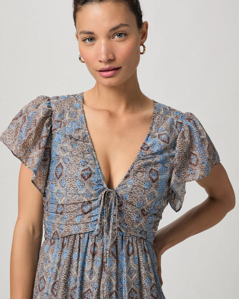 We love an easy to wear dress in the Summer and this maxi from Paige does not disappoint!&nbsp; Crafted from a luxuriously soft cotton/silk blend and featuring short flutter sleeves, a flattering v neckline with tie details, a shirred bodice and a full tiered skirt this is a dress that will suit multiple occasions.&nbsp; Easy to dress up or down.&nbsp; A great Summer dress!