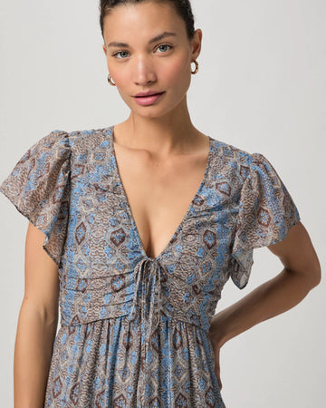 We love an easy to wear dress in the Summer and this maxi from Paige does not disappoint!&nbsp; Crafted from a luxuriously soft cotton/silk blend and featuring short flutter sleeves, a flattering v neckline with tie details, a shirred bodice and a full tiered skirt this is a dress that will suit multiple occasions.&nbsp; Easy to dress up or down.&nbsp; A great Summer dress!