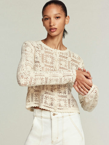 Talk about an elevated humble cardigan!&nbsp; This gorgeous little cardi from uber cool brand Frame is crafted from pure cotton and features a geometric open knit pattern throughout and scalloped edging.&nbsp; For an added bit of luxury this has been finished with fabric covered buttons.&nbsp; Charming and feminine this is perfect paired with your favourite denim.