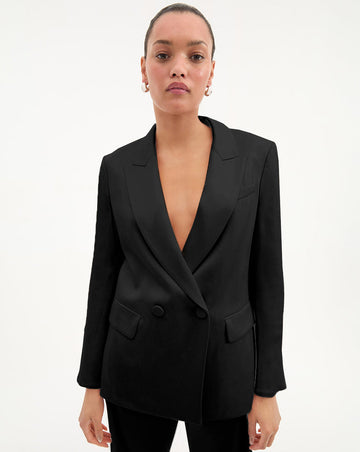 We all need a really cool, simple grown up black jacket that looks like we borrowed it from a gentleman.&nbsp; Enter the expertly tailored Sevyn Jacket.&nbsp; Crafted from a premium stretch blend this is an elongated blazer with a relaxed fit and a beautiful drape.&nbsp; The double breasted silhouette works equally well over dresses or denim and will quickly become a jacket you reach for again and again.&nbsp; Elegant, effortless dressing at it's finest.