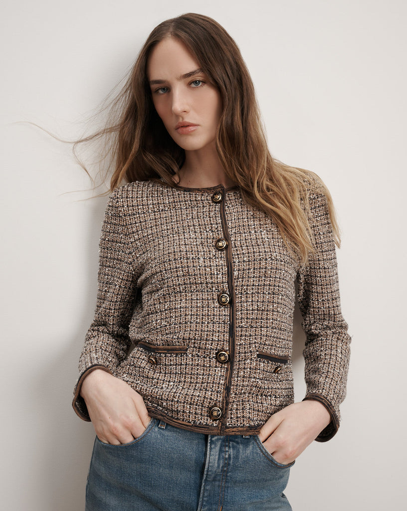 The expertly tailored Brisa Knit Jacket will quickly become your go to jacket.&nbsp; Stylish, chic dressing at it's finest.&nbsp; Spun from premium stretch fabric and featuring a boxy, cropped fit, a collarless neckline, Veronica Beard's signature crest buttons and a contrast trim this is perfect paired with your favourite denim to elevate your day look.&nbsp; Also looks fab paired with a slinky silk skirt.