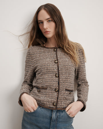 The expertly tailored Brisa Knit Jacket will quickly become your go to jacket.&nbsp; Stylish, chic dressing at it's finest.&nbsp; Spun from premium stretch fabric and featuring a boxy, cropped fit, a collarless neckline, Veronica Beard's signature crest buttons and a contrast trim this is perfect paired with your favourite denim to elevate your day look.&nbsp; Also looks fab paired with a slinky silk skirt.