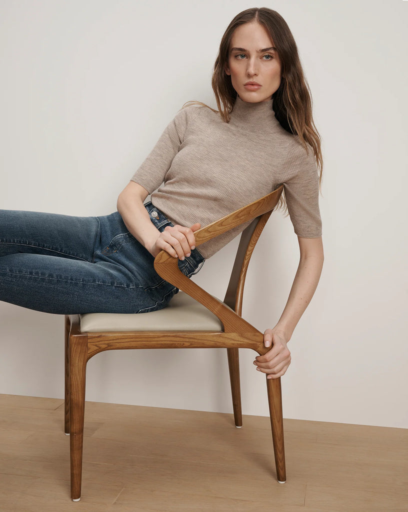A wardrobe necessity!&nbsp; The Alastair Merino wool knit from Veronica Beard is crafted from super soft pure Merino Wool and features a mock turtleneck, just short of elbow length sleeves and soft ribbing.&nbsp; Perfect under jackets this is an excellent layering piece.&nbsp; It won't make you too hot and will always make you look polished.&nbsp; Also available in a navy.