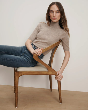 A wardrobe necessity!&nbsp; The Alastair Merino wool knit from Veronica Beard is crafted from super soft pure Merino Wool and features a mock turtleneck, just short of elbow length sleeves and soft ribbing.&nbsp; Perfect under jackets this is an excellent layering piece.&nbsp; It won't make you too hot and will always make you look polished.&nbsp; Also available in a navy.