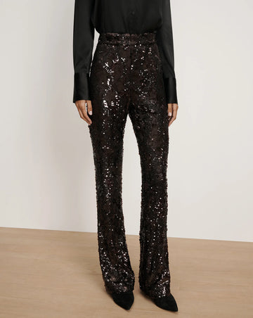 Wow!&nbsp; Make a statement with the Collier Sequin trouser from Veronica Beard!&nbsp; Embellished with all over maroon sequins these cool trousers feature a slim fit, flared leg, back zipper closure and a flattering high rise waist.&nbsp; For a soft look pair with the matching Thelma cashmere cardi from the Veronicas.&nbsp; A perfect party piece!