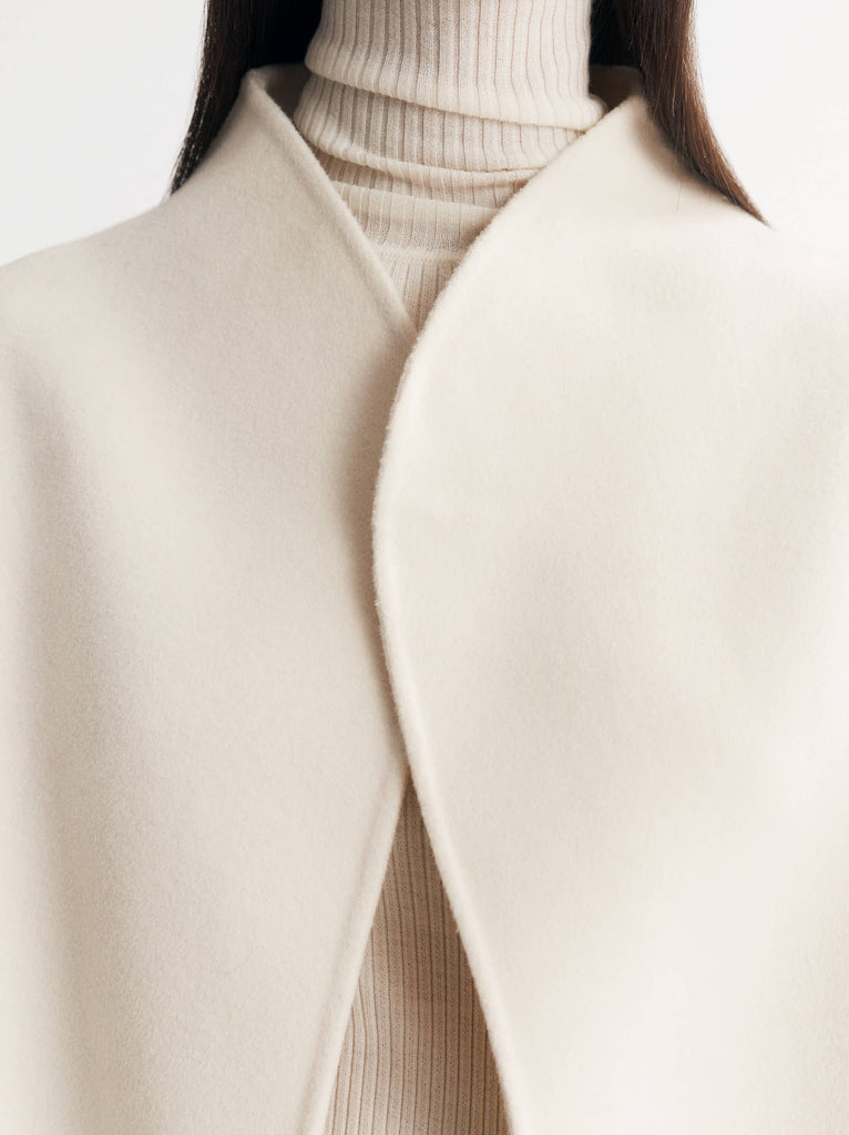 Ah - you know when the temperature drops a bit and you're wearing trousers or jeans (or even your yoga or pilates kit) and you want an extra layer but want to look chic and elegant - this is that layer!&nbsp; Crafted&nbsp; from a super soft wool and cashmere blend and with an oversized fit in timeless white this will quickly become a go to jacket.