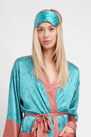 The super comfy padded blackout silk sleep mask from Jessica Russell Flint is crafted from the softest silk and will help guarantee a good night's sleep.&nbsp; Shown here in the "Teal Stars" print these make a super gift for a friend or a treat for yourself and matches perfectly with the "Teal Stars" pyjamas!