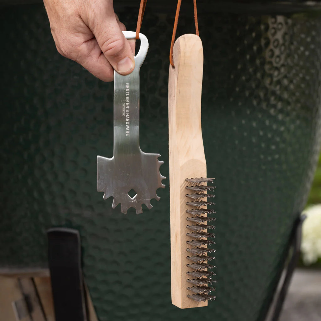 Elevated your BBQ accessories with this fab little cleaning kit from Gentlemen's Hardware.&nbsp; Featuring a grill scraper and a wire brush, convenient hanging loops and always essential - a bottle opener on the end of the scraper - this makes a perfect gift for the man in your life!