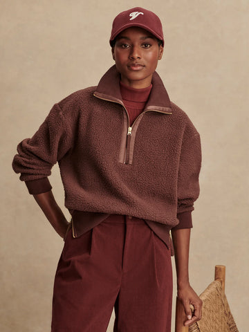 The Roselle Fleece from Varley is crafted from their 100% Recycled Plush Borg Fleece. It is a loose fit and features a half-zip collar, ribbed cuffs and hem, and zip detailing on the sides. The top will sit perfectly over any of the Varley pants or leggings and will be a welcome upgrade to your lounge/ travel/ gym wear.