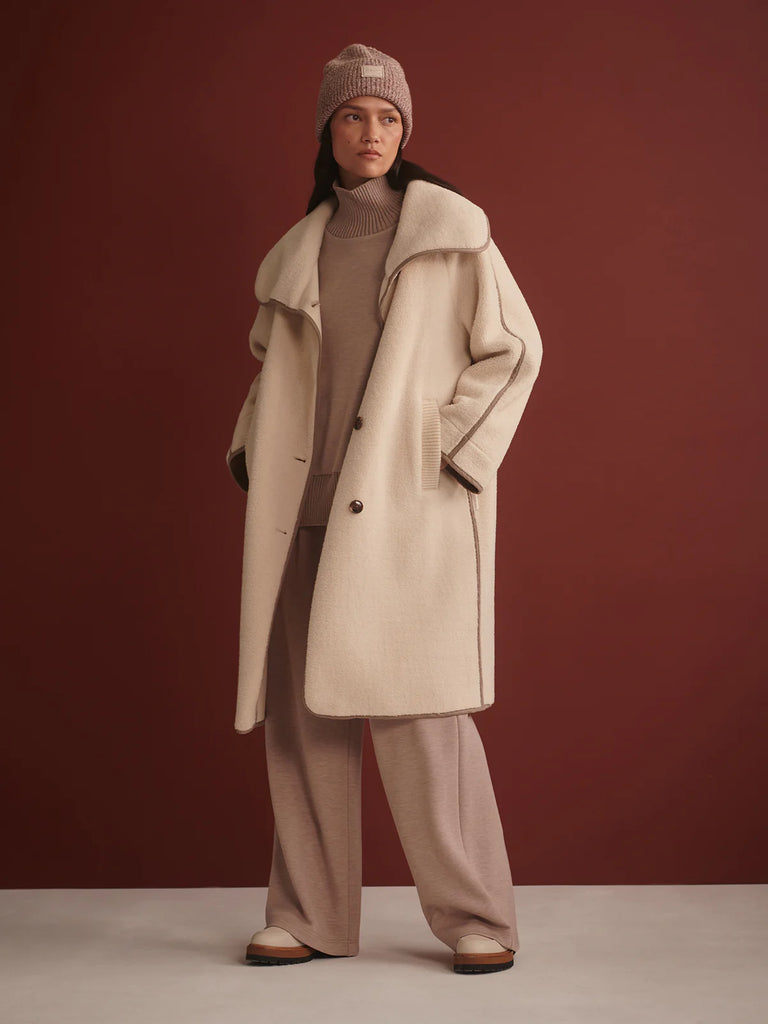 The Clemence Sherpa Coat from Varley is crafted from a luxurious Bonded Fleece and cut to a boxy, longline silhouette. It is a minimalist design and features a button-up front, contrast binding and knitted pockets. It's perfect for layering over all your Varley pieces.



