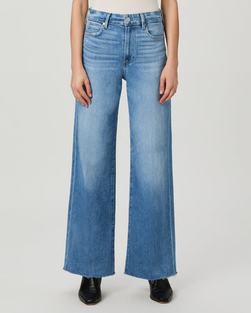 This modern high waisted wide leg jean from Paige has an easy relaxed fit and the elongated silhouette gives an effortlessly chic look. Crafted from Paige's signature vintage denim and featuring an extra long length and raw hem these will feel perfectly lived in from the first wear. Pair with a neat tee or knit on top for a classic daytime look.