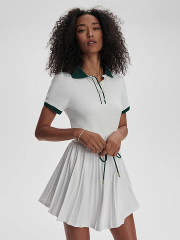 Tennis season is upon us and the Paloma dress with its preppy polo shirt style top and classic pleated skirt fits the bill. With a contrasting green drawcord for a perfect fit and featuring removable shorts this dress can work both on and off the court.