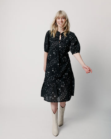 Easy throw on and go dress from uber cool Scandi brand Moliin!&nbsp; Featuring a flattering v neck with self ties, elastic empire length waistband and a tiered skirt this dress is flowy and feminine.&nbsp; Pair with a trainer for an elevated day look or a pretty sandal for evening drinks.