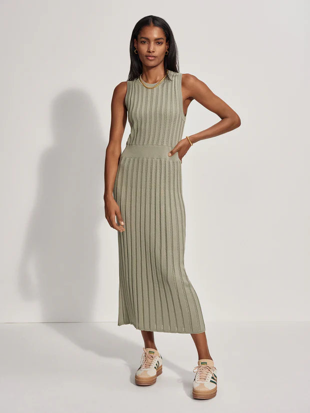 The form-fitting Florian Knit Dress from Varley is an elegant addition to your summer wardrobe. Crafted from their lightweight pointelle knit, it comes in a mid-length and features a round neck and a ribbed waistband, which adds a touch of definition. Pairs equally well with trainers, sandals and loafers. 