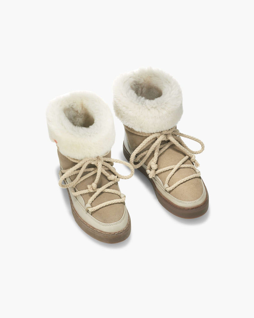 We are very excited to be stocking these amazing snowshoes by uber cool brand Inuikki.&nbsp; Inuikki translates to "beauty of the cold" and these sneaker style shoes will make you want to do just that!&nbsp; Fully line and cuffed with shearling to keep your toes toasty and a functional toggle tie for the laces, they will not only up your style but are practical and comfortable too.&nbsp;&nbsp;