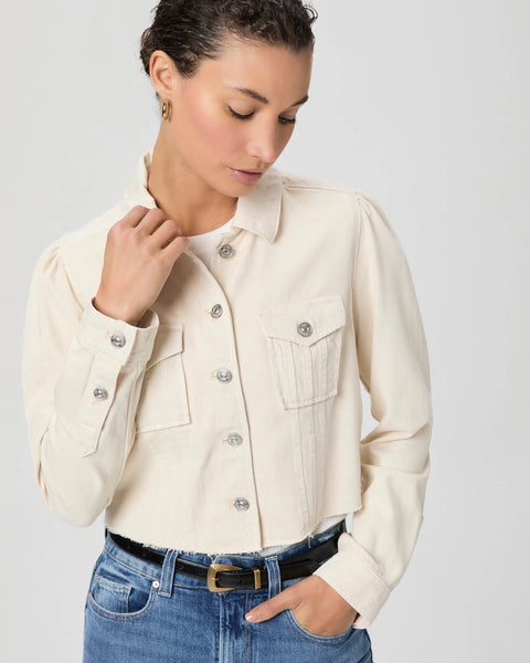 A totally fresh take on our favourite denim jacket from Paige.&nbsp; Crafted from super soft stretchy twill in an always wearable neutral and featuring a raw hem, utility patch pockets, a boxy fit, subtle puff sleeves and in a cute cropped length this is perfect with your wide leg or relaxed denim.