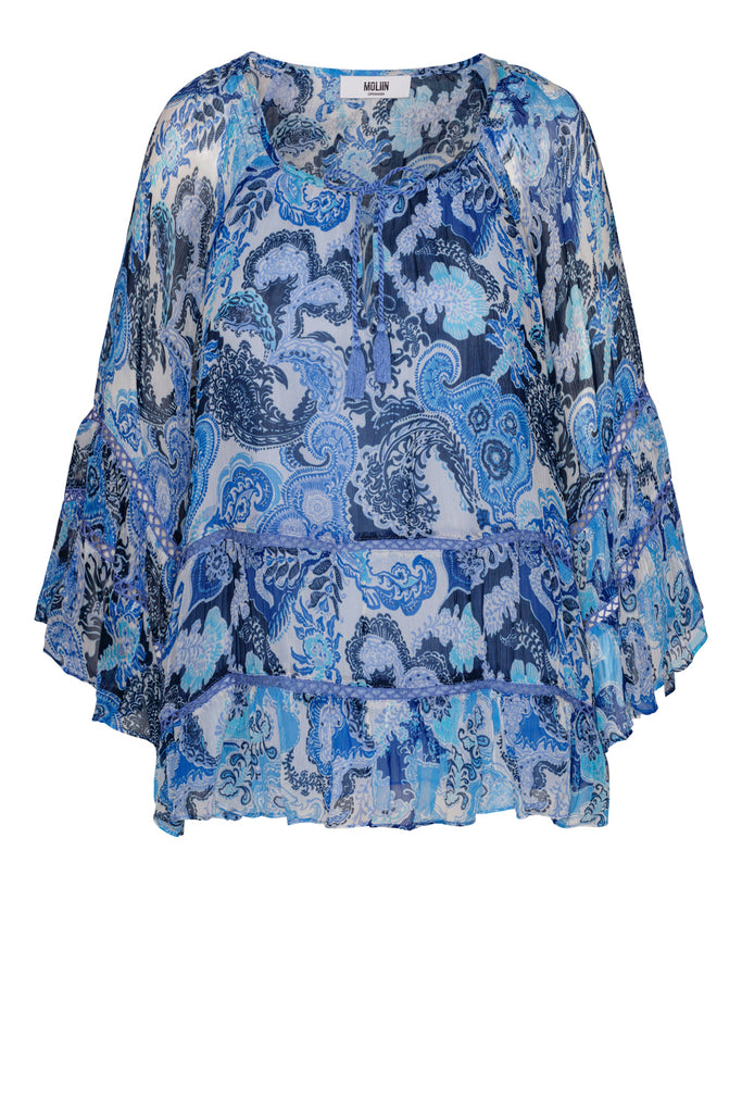 Such a pretty blouse!&nbsp; Gillian from uber cool Scandi brand Moliin is feminine and flirty.&nbsp; Featuring a flattering v neck and tassels, tiered floaty sleeves and hem this is the perfect top with your favourite denim jeans or shorts when the temperatures rise.