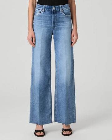 This modern high waisted wide leg jean from Paige has an easy relaxed fit and the elongated silhouette gives an effortlessly chic look. Crafted from Paige's signature vintage denim and featuring an extra long length and raw hem these will feel perfectly lived in from the first wear. Pair with a neat tee or knit on top for a classic daytime look.