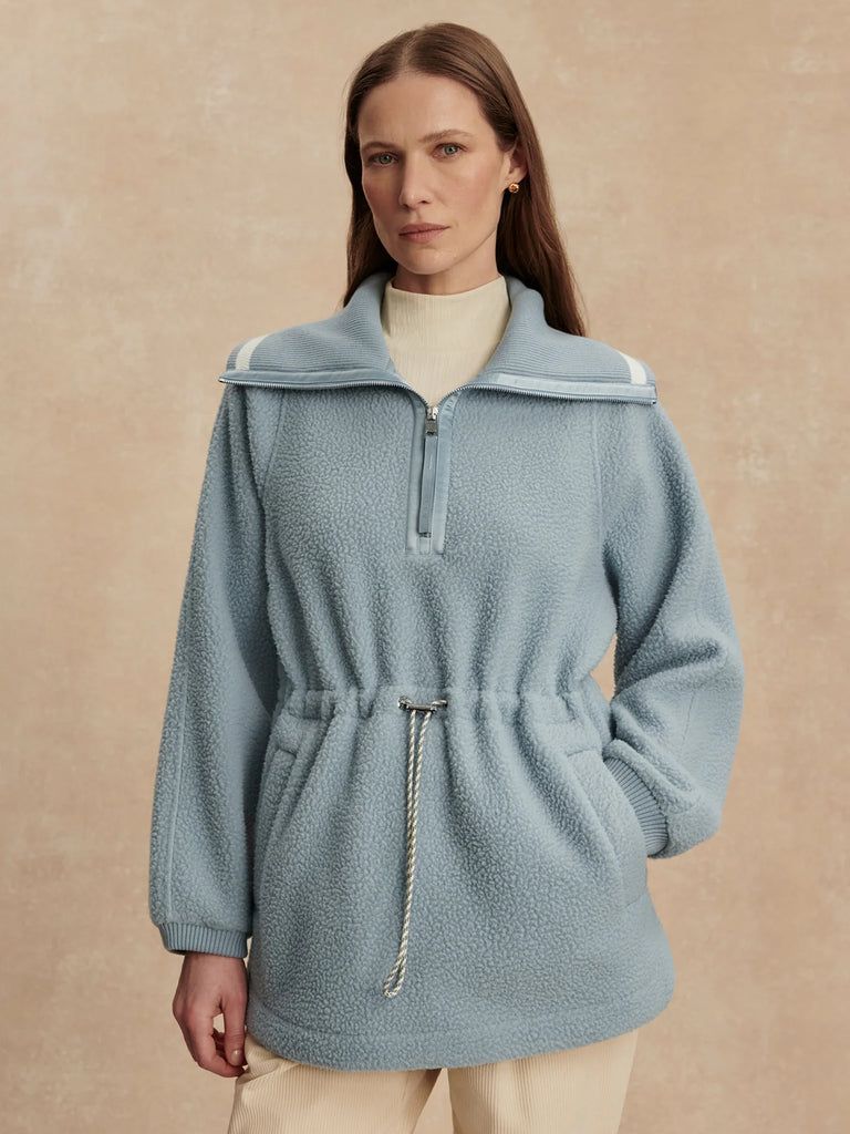 The Ashby half-zip from Varley is made from their warm and insulating Plush Borg Fleece and features stripe detailing along the collar and an adjustable toggle to cinch in the waist. It's a longline shape and an oversized fit and is perfect for layering over leggings, baselayers, and slim trousers.


