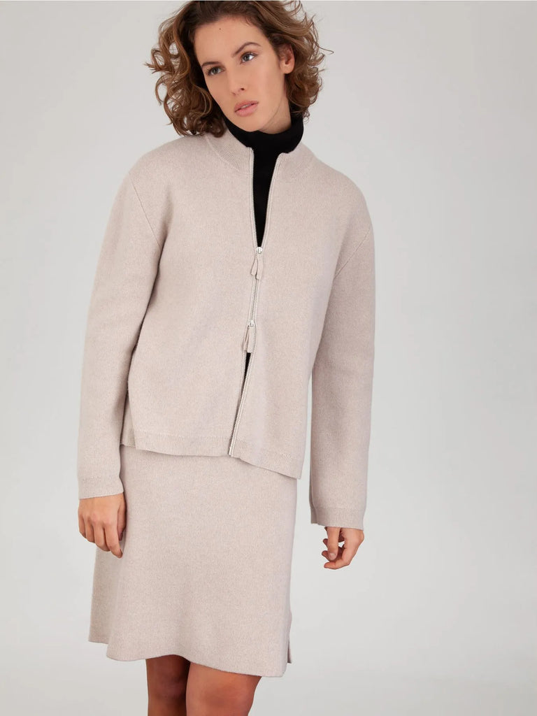 This Mockneck Cardigan from FTC Cashmere has a slight a-line fit and features side slits and ribbed trims at the hem and cuffs. This double faced cardigan has a zip-down front and is perfect for wearing both in and outdoors.