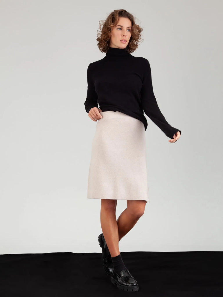 This Skirt from FTC Cashmere is double faced and features an elasticated waistband, a slight a-line shape and a fine hemline. This knee-length skirt is the perfect piece to wear as we transition into the new season. Pair with the matching Mockneck Cardigan for the full look!