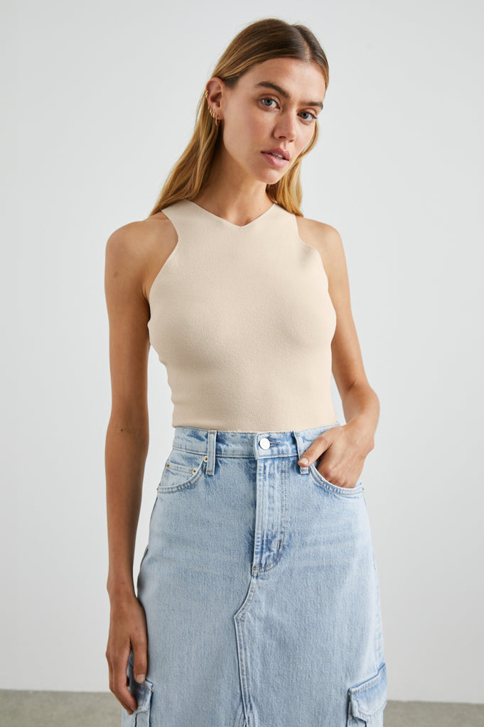 Say hello to Ally!&nbsp; This is the perfect little vest top to pair with all your wide legged and relaxed denim.&nbsp; In an always wearable neutral and featuring a flattering cut in on the shoulders and a very neat fit this knit will quickly become a wardrobe staple.