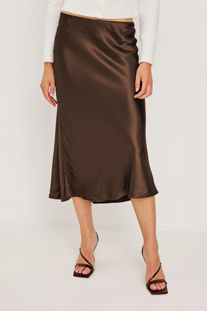Anya is a super silky satin crepe midi skirt, featuring a concealed elasticated waistband and an extremely flattering bias cut.&nbsp; In a rich luxurious looking chocolate this looks fab paired with a bit chunky knit or dress it up with a little silky top for an evening look!