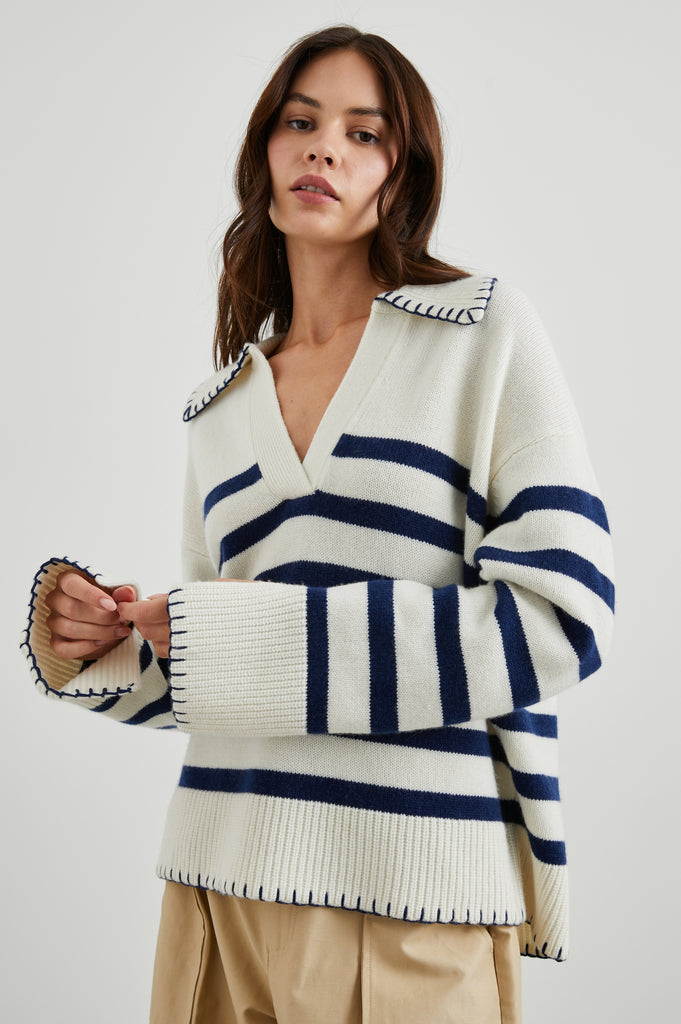 The Athena Sweater from Rails is crafted from a wool and cashmere blend. Complete with a collared v-neckline and contrast stitching at the hem and cuffs - this sweatshirt combines warmth with a sunny nautical feel making this the perfect transitional piece.