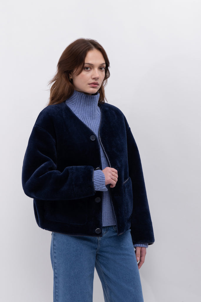 We love a coat that is 2 in 1!&nbsp; This is an excellent example of function meets style!&nbsp; With faux leather on one side and faux fur on the other this is the perfect weekend jacket.&nbsp; In a gorgeous navy this will quickly become your go to jacket with your favourite denim.&nbsp;