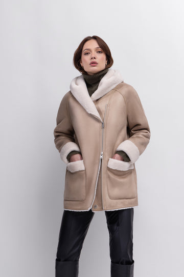 We love a coat that is 2 in 1!&nbsp; This is an excellent example of function meets style!&nbsp; With faux suede on one side and faux fur on the other this is the perfect weekend jacket.&nbsp; In a gorgeous taupe on one side and with the fur side in winter white and a much appreciated hood this looks fab paired with. your favourite denim for your weekend walkies!